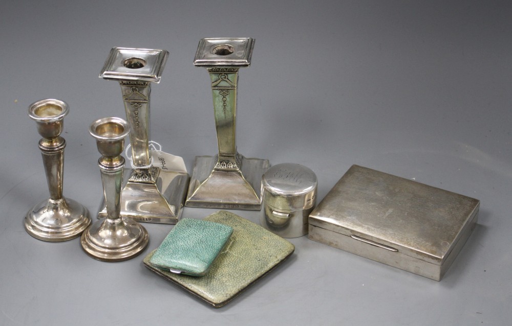 A pair of modern silver dwarf candlestick, Birmingham, 1963, 10.7cm, loaded and six other items.
